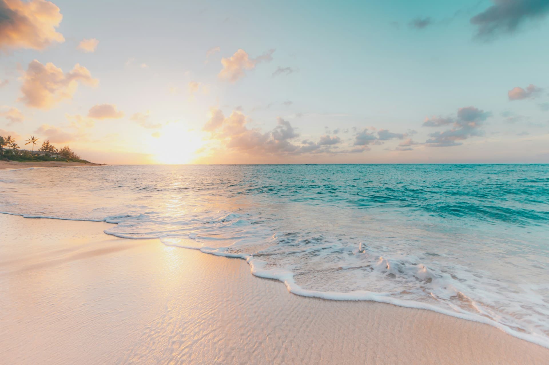 Crystal-clear turquoise beach and palm-lined coast